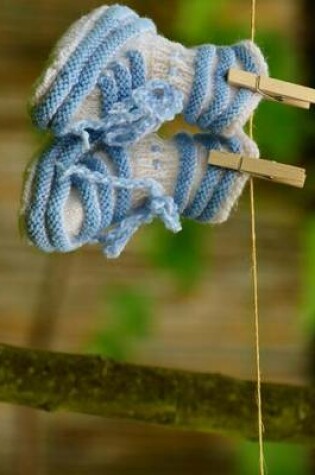 Cover of Jumbo Oversized Newborn Blue Baby Shoes on a Clothesline