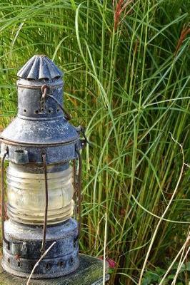 Book cover for An Old Lantern in the Grass Journal