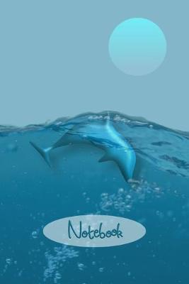 Book cover for Dolphins Playing in Clear Water Notebook