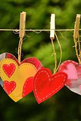 Book cover for Three Paper Hearts on a Clothesline