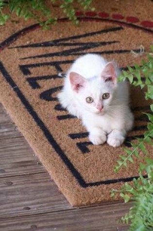 Cover of White Kitten Sitting on a Welcome Mat Journal