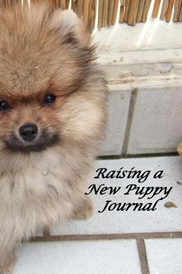 Book cover for Raising a New Puppy Journal