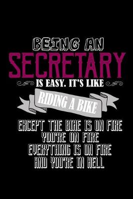 Book cover for Being a secretary is easy. It's like riding a bike. Except the bike is on fire, you're on fire, everything is on fire and you're in hell