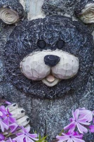 Cover of A Bear Carving on a Tree in a Garden