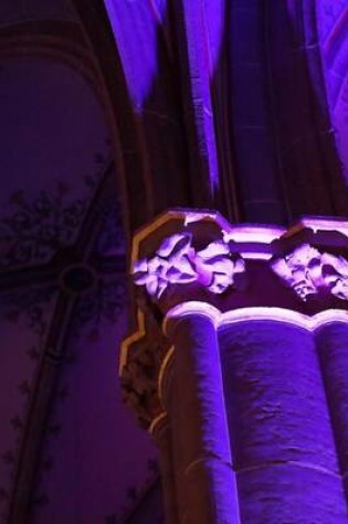 Cover of An Ornate Pillar Inside of a Church Lit Up in Purple