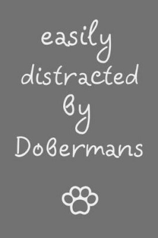 Cover of Easily distracted by Dobermans