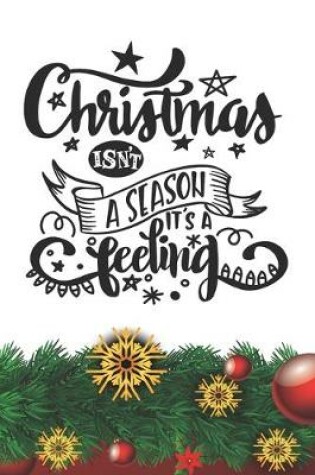 Cover of Christmas Isn't a Season - It's a Feeling Notebook