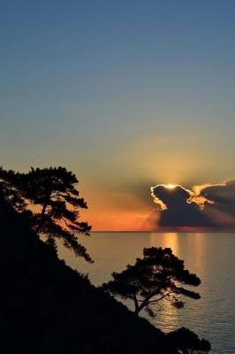 Book cover for Silhouetted Trees and Golden Etched Clouds and an Ocean Sunset Journal