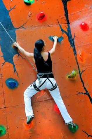 Cover of A Woman Climbing Up a Rock Wall Sports Journal