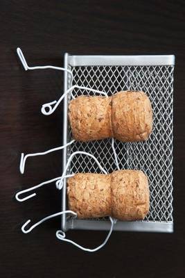 Book cover for Two Wine Corks Sitting on a Bench