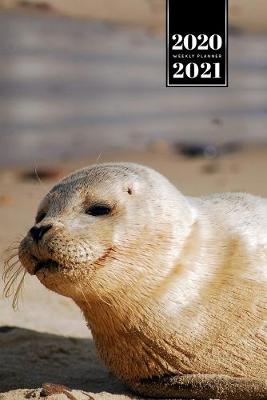 Cover of Seal Manatee Sea Lion Cow Walrus Dugong Week Planner Weekly Organizer Calendar 2020 / 2021 - Tired on Beach