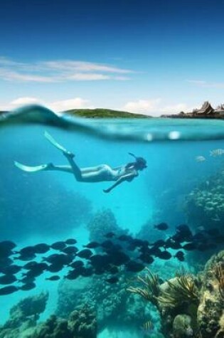 Cover of Woman Snorkeling by a Coral Reef in the Ocean Journal