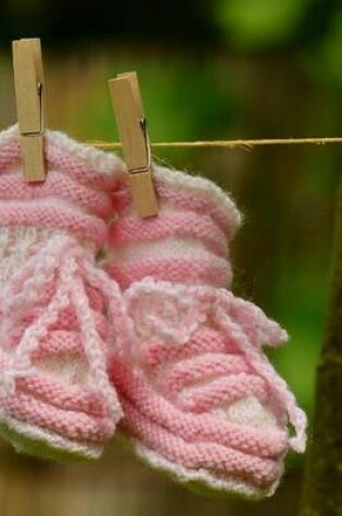 Cover of Newborn Pink Baby Shoes on a Clothesline