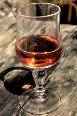 Book cover for Glass of Cognac on a Rustic Wood Table