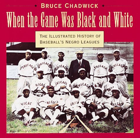 Book cover for When the Game Was Black and White: the Illustrated History of Baseball's Negro Leagues