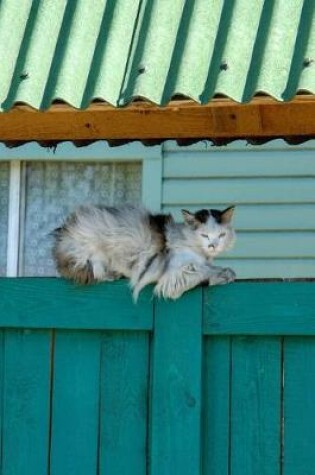 Cover of Cat Relaxing on a Green Fence Journal