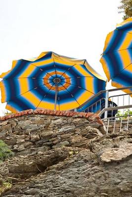 Book cover for Blue and Yellow Umbrellas at a Cafe on the Cliff