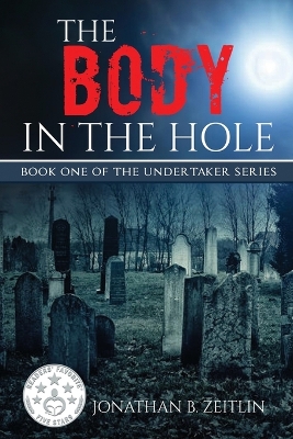 Book cover for The Body in the Hole