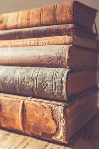 Cover of Cool Stack of Antique Books on a Table Journal