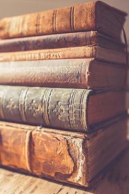 Book cover for Cool Stack of Antique Books on a Table Journal