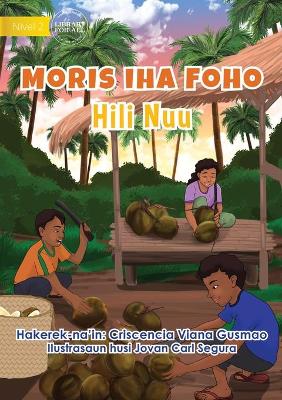 Book cover for Living in the Village - Harvesting Coconuts - Moris Iha Foho - Hili Nuu