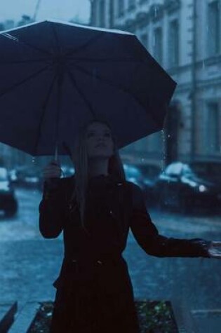 Cover of A Woman Standing on a Street Corner in the Rain