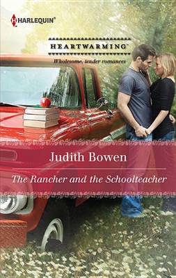 Book cover for The Rancher and the Schoolteacher