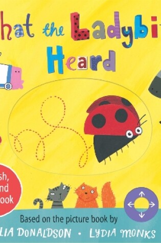 Cover of What the Ladybird Heard: A Push, Pull and Slide Board Book