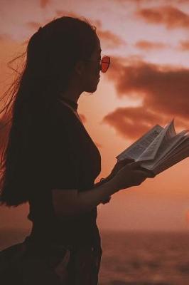 Book cover for Woman with a Book on the Beach at Sunset Vacation Journal