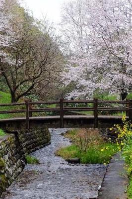 Book cover for Trees Full of Cherry Blossoms and a Foot Bridge in Japan Journal