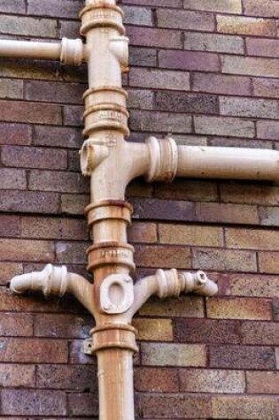 Cover of Pipes on an Old Brick Building