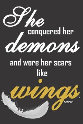 Book cover for She conquered her demons and wore her scars like wings.