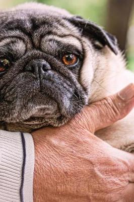 Book cover for A Man Holding a Pug Dog Journal