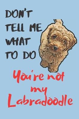 Book cover for Don't tell me Labradoodle Blank Lined Journal Notebook