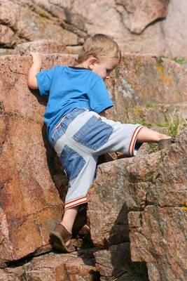 Book cover for Determined Little Boy Climbing on Rocks Journal