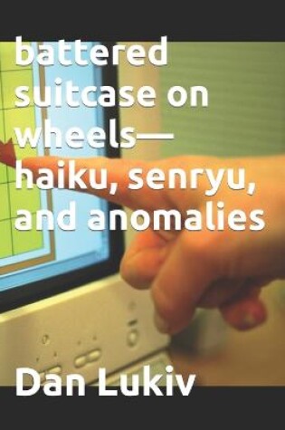 Cover of battered suitcase on wheels-haiku, senryu, and anomalies