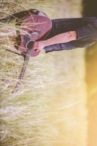 Cover of Country Singer in a Field with a Guitar