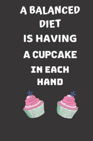 Cover of A balanced diet is having a cupcake in each hand