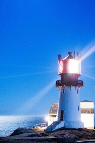 Cover of The Lindesnes Lighthouse Lit Up at Night in Norway