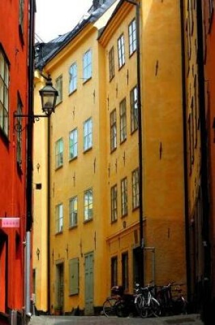 Cover of Bicycles and Colorful Buildings on a Street in Old Town Stockholm Sweden Journal