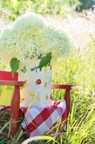 Cover of Hydrangeas in a Vase on a Red Chair in the Garden