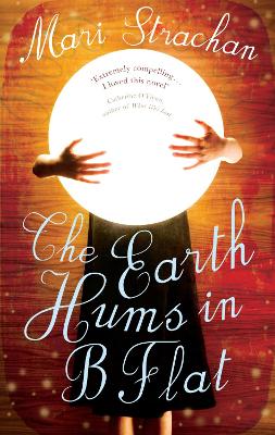 Book cover for The Earth Hums in B Flat