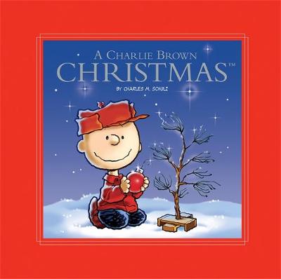 Book cover for Peanuts: A Charlie Brown Christmas Deluxe Ed