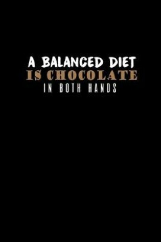 Cover of A balanced diet is chocolate in both hands