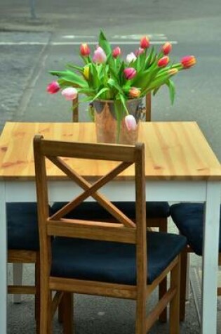 Cover of Beautiful Flower Arrangement on the Table at the Cafe