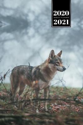 Book cover for Wolf Wolves Week Planner Weekly Organizer Calendar 2020 / 2021 - Misty Forest