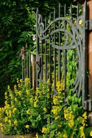 Cover of Yellow Flowers Growing in Front of a Wrought Iron Gate