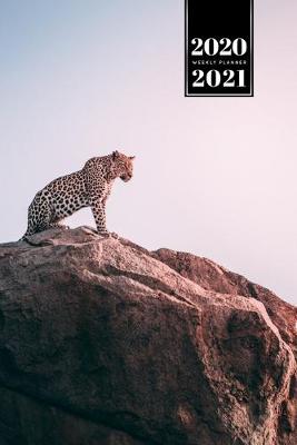 Book cover for Panther Leopard Cheetah Cougar Week Planner Weekly Organizer Calendar 2020 / 2021 - Sunset on Mountain Top