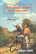 Book cover for Encyclopedia Brown Tracks Them Down