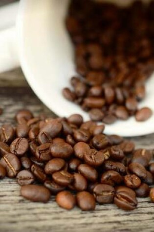 Cover of Coffee Beans and a Mug Spilled on a Bench